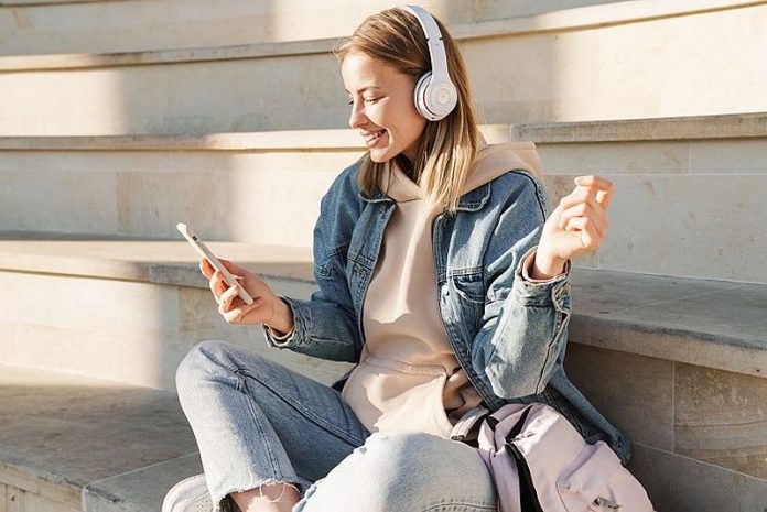Beautiful young blonde woman wearing denim jacket